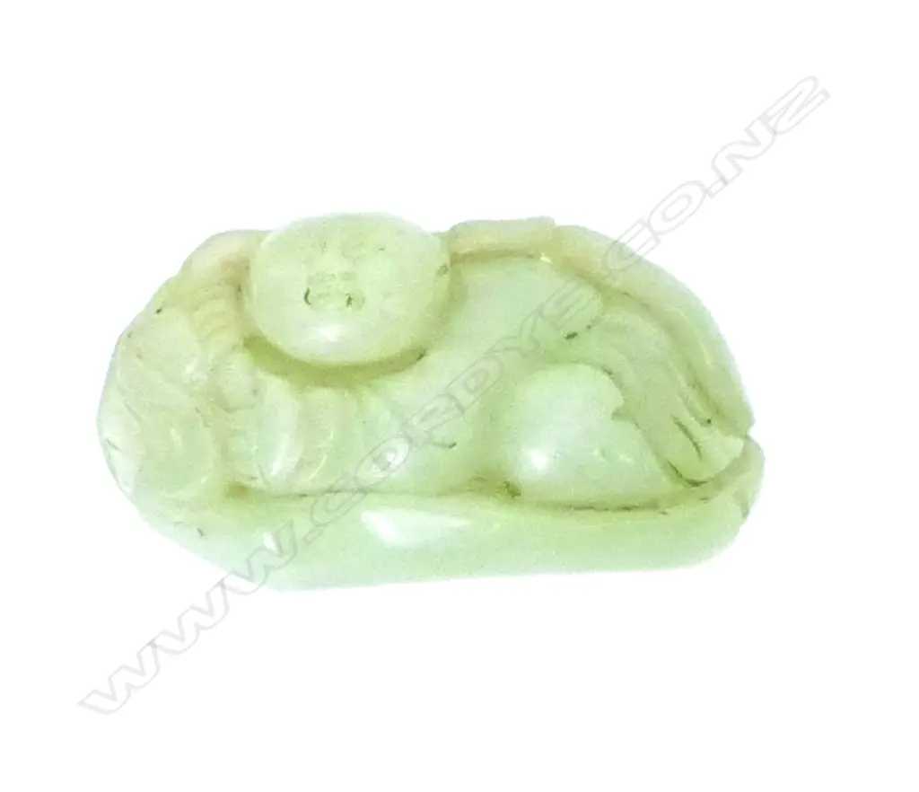 A carved milky pale green jade fingering piece Image 1++