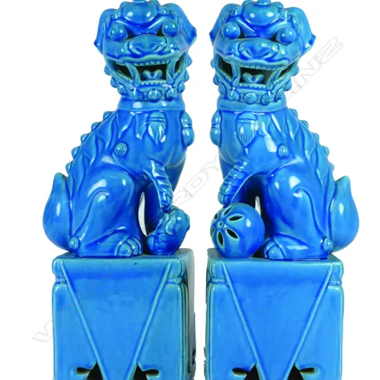 A pair of Chinese turquoise glazed lion dogs
