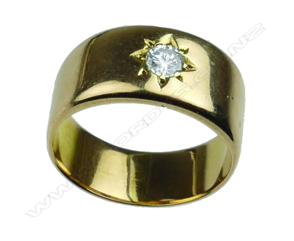 An 18ct. yellow gold band set with a brilliant cut diamond Image 1++