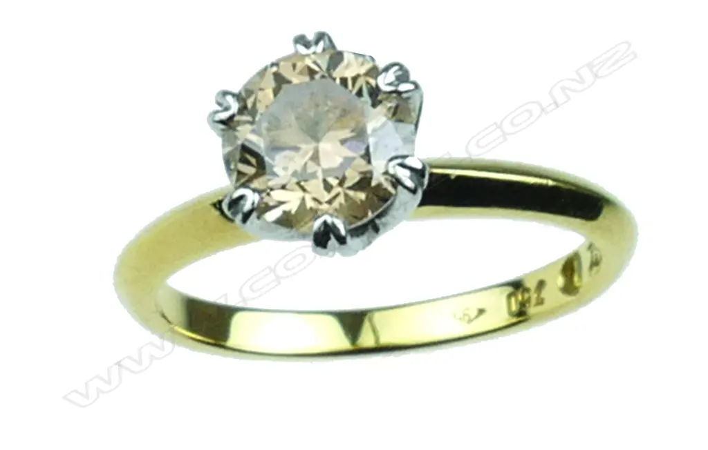 An 18ct. gold and diamond solitaire ring Image 1++