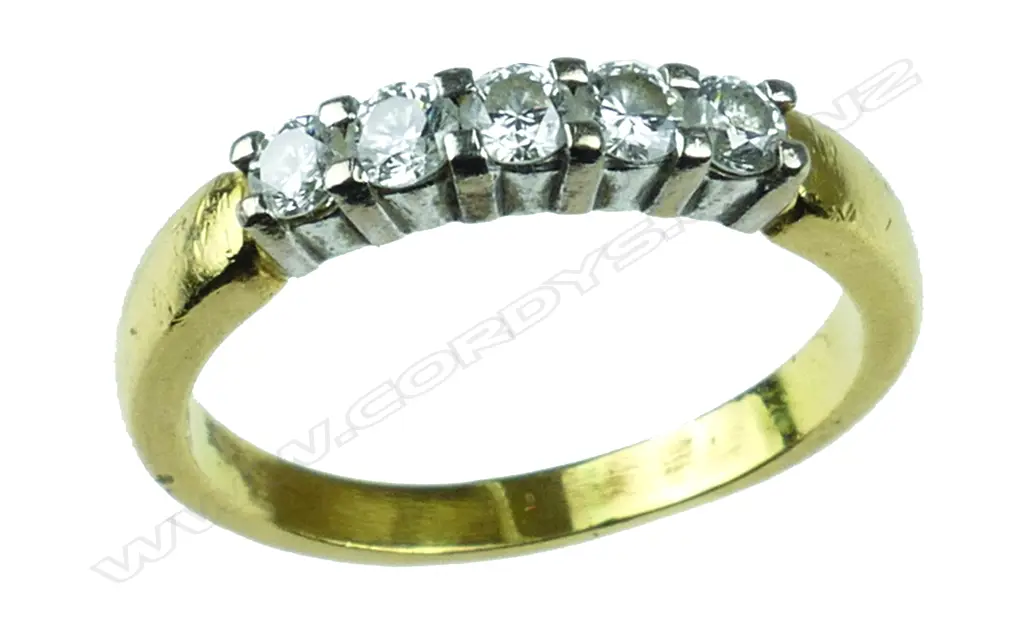 An 18c.t gold and diamond band Image 1++