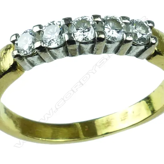 An 18c.t gold and diamond band