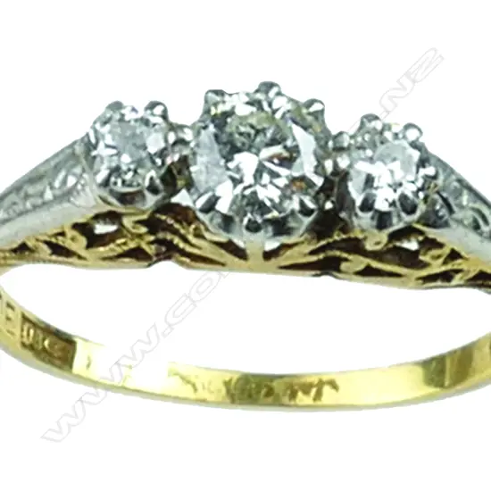 An 18ct. gold three stone diamond ring