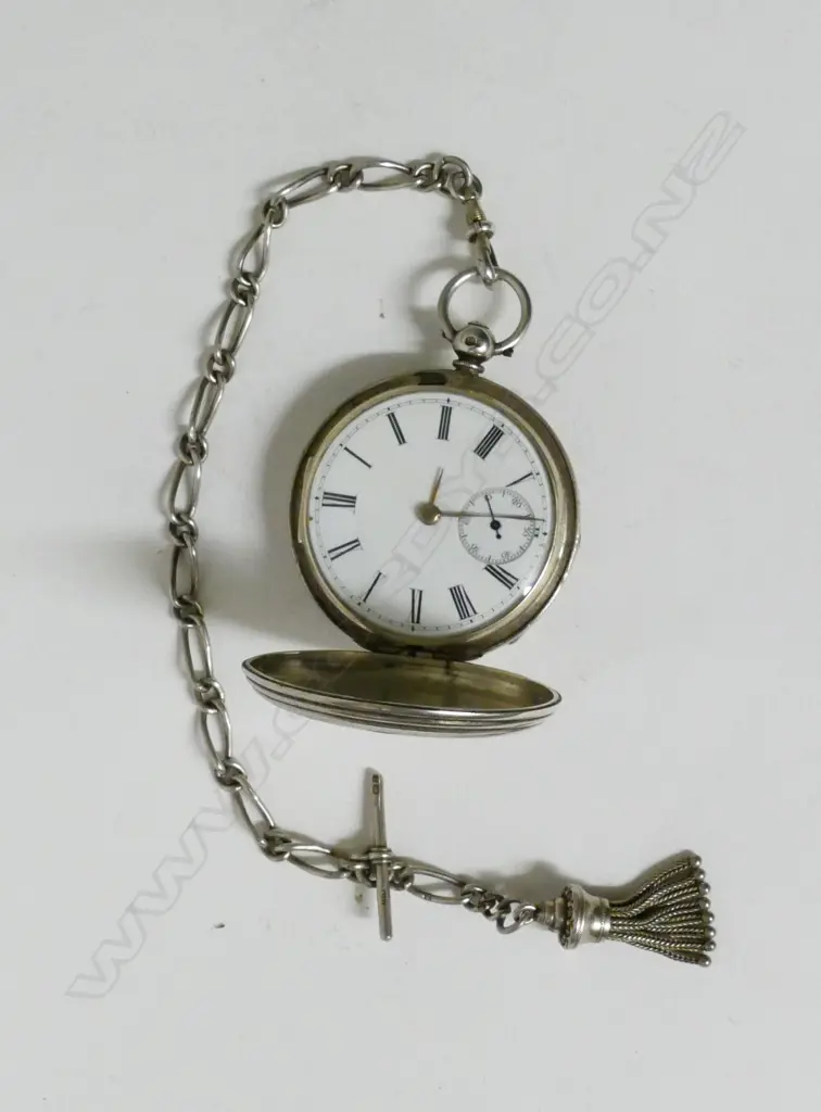 A Victorian silver hunter pocket watch and fob chain Image 1++