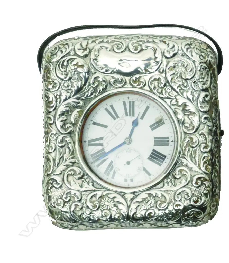 An Edwardian embossed silver covered pocket watch stand with watch Image 1++