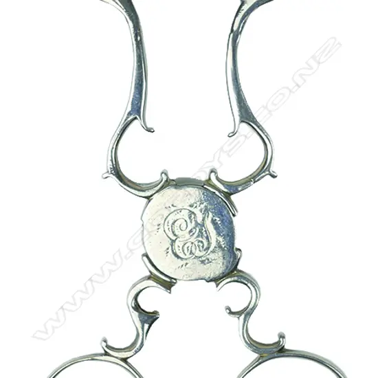 A pair of early George III silver action sugar nips