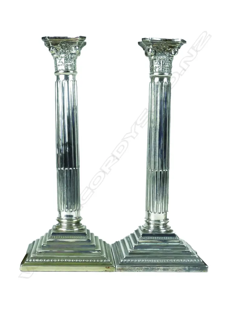 A pair of silver plate Corinthian column candlesticks Image 1++
