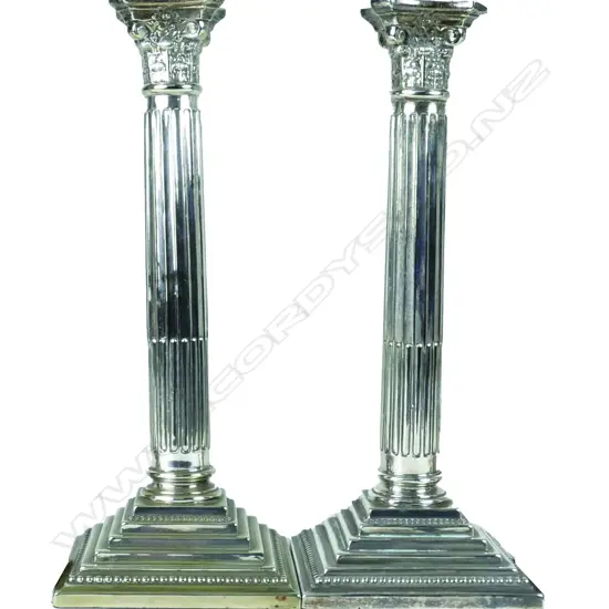 A pair of silver plate Corinthian column candlesticks