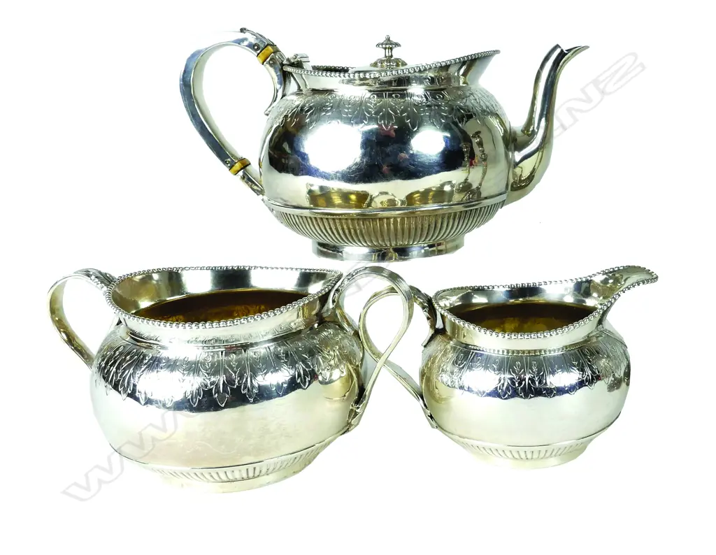 A Victorian heavy three-piece silver tea service Image 1++