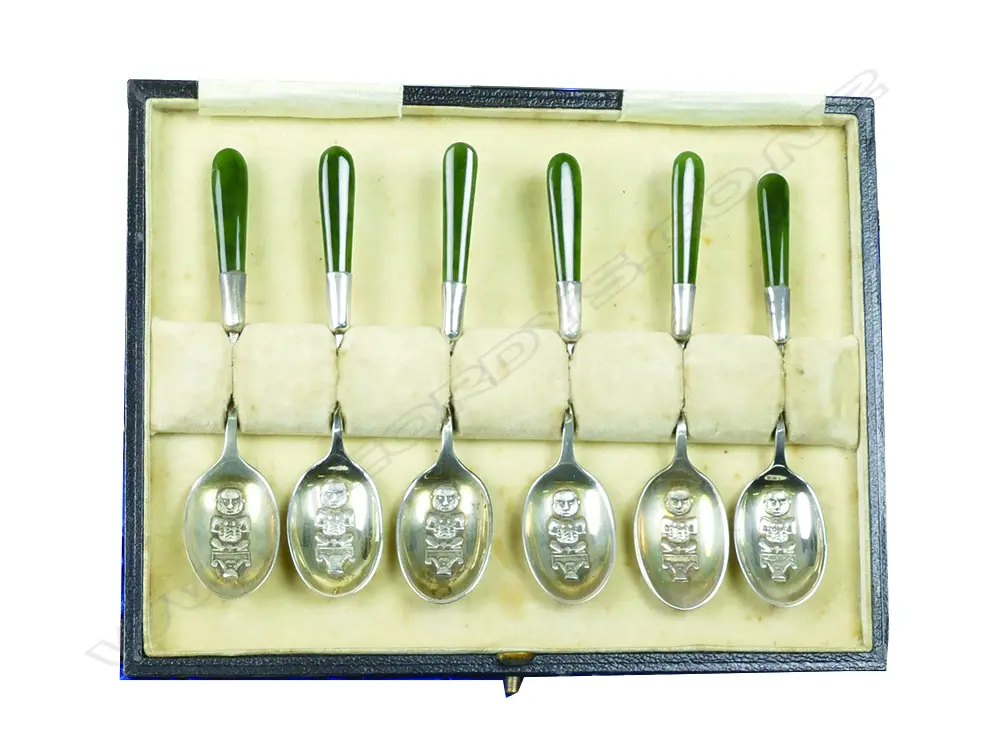 A set of silver teaspoons decorated with Maori motifs and greenstone handles Image 1++