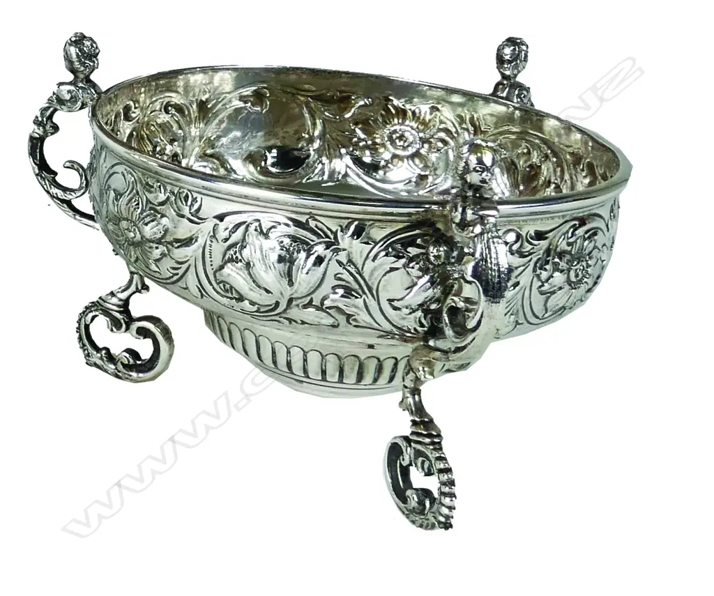 A silver bowl raised on three caryatid legs Image 1++