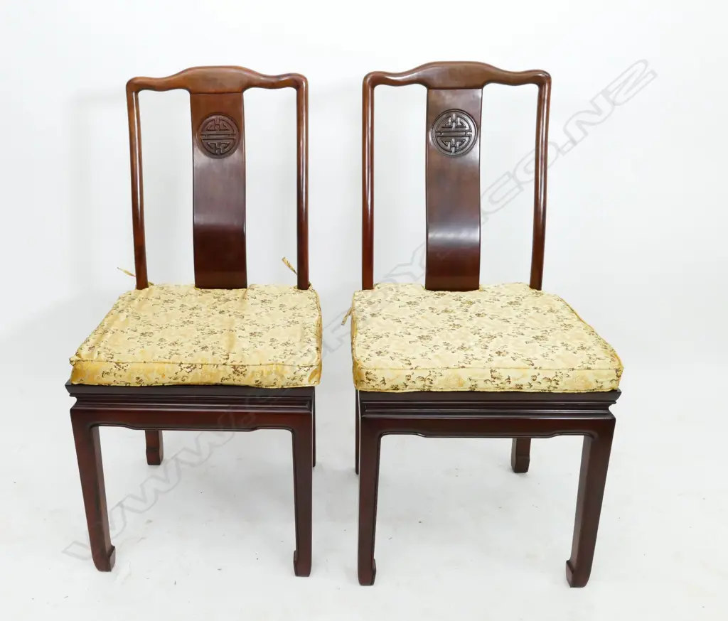 A Chinese rosewood extension banquet table and eight chairs Image 1++