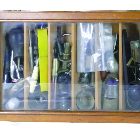 A vintage rimu display box and contents