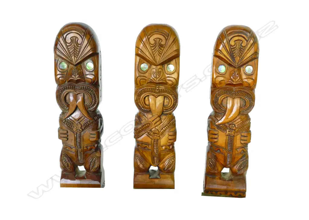 Three carved wooden Maori tiki figures Image 1++