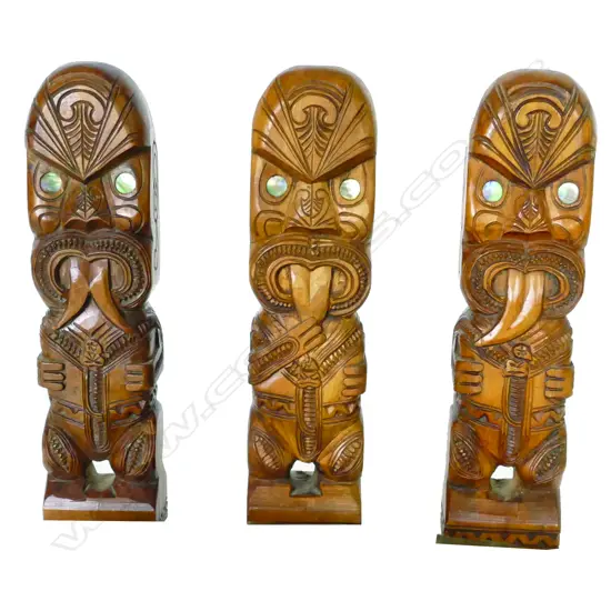 Three carved wooden Maori tiki figures