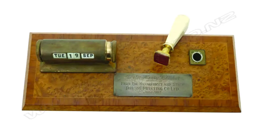 A 1960s burr totara and brass calendar/desk stand Image 1++