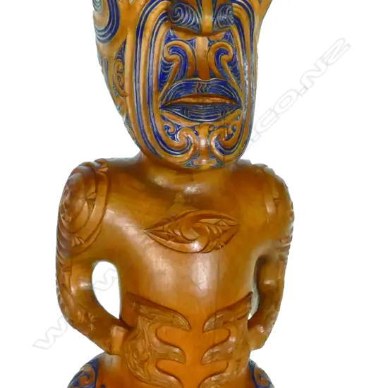 A modern Maori finely carved stylised figure
