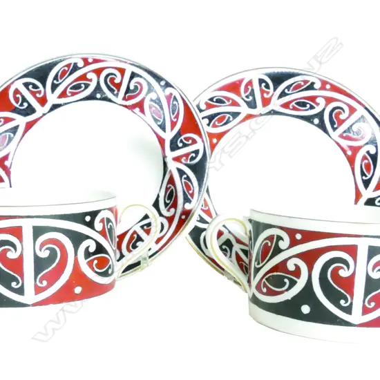 A pair of Royal Doulton 'Maori Arts' porcelain coffee cans and saucers