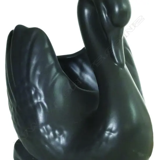 A Crown Lynn medium size black glazed swan