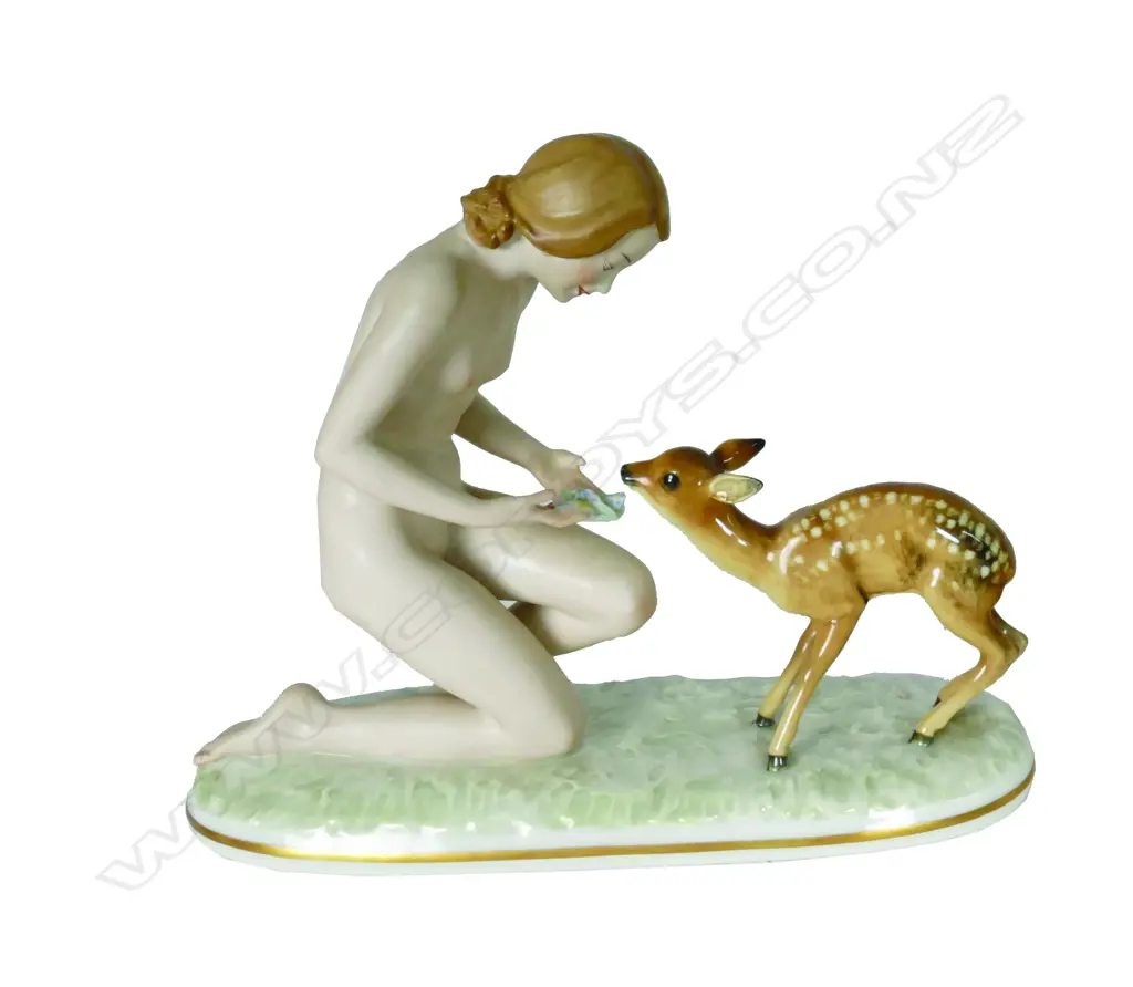 A Hutschenreuther mid-20thC porcelain figure group of a naked young woman with fawn Image 1++