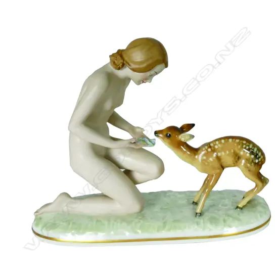A Hutschenreuther mid-20thC porcelain figure group of a naked young woman with fawn