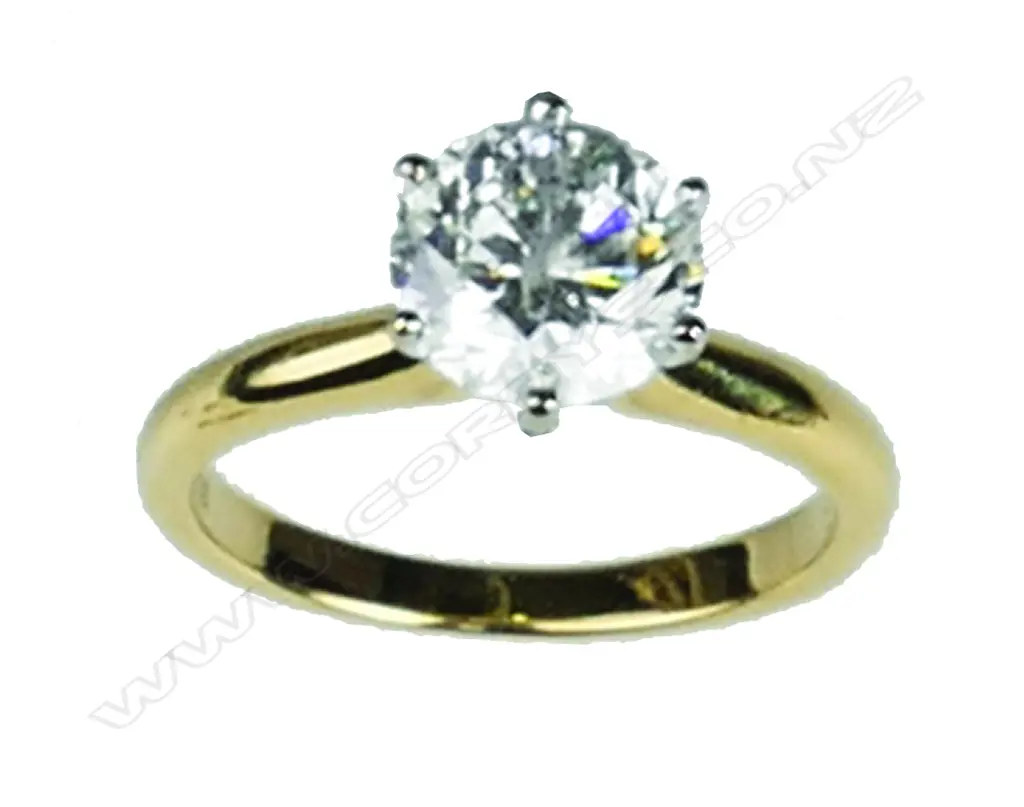 An 18ct. yellow gold and diamond solitaire ring Image 1++