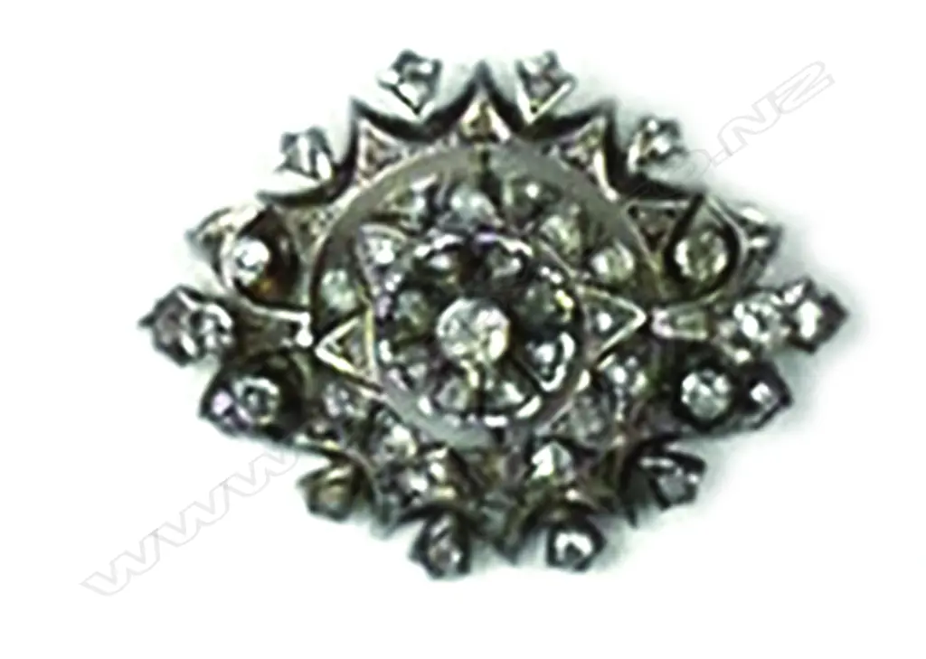 An antique silver and diamond brooch Image 1++