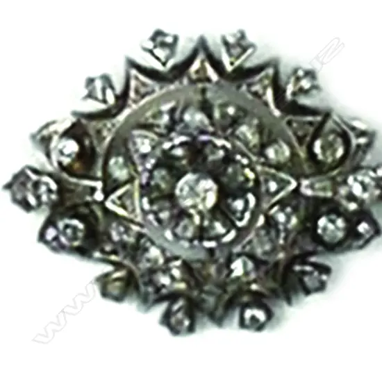 An antique silver and diamond brooch