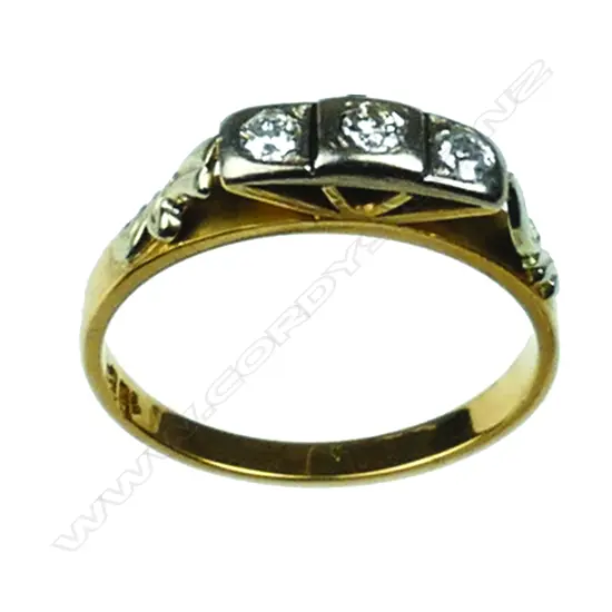 An 18ct. gold and three stone diamond ring