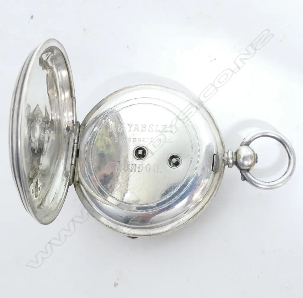 A silver pocket watch Image 1++