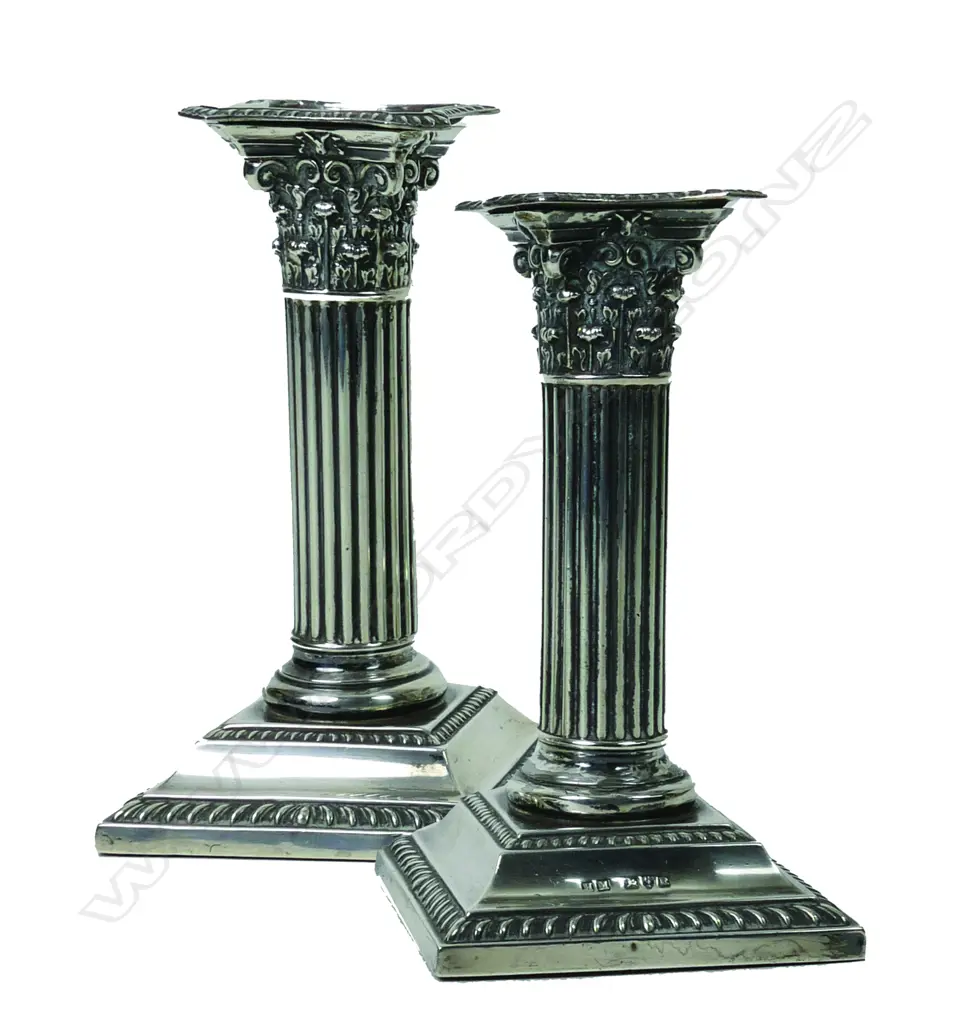 A pair of Edwardian silver Corinthian column candlesticks Image 1++