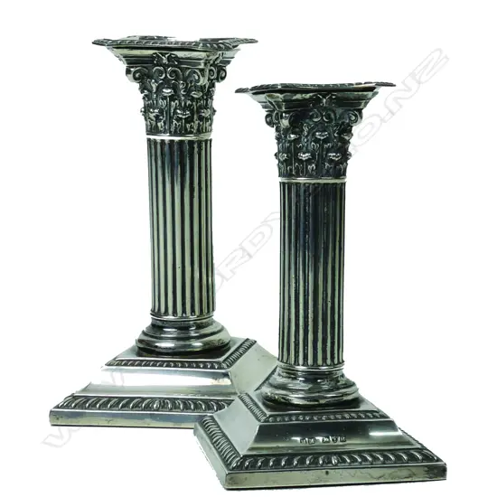 A pair of Edwardian silver Corinthian column candlesticks