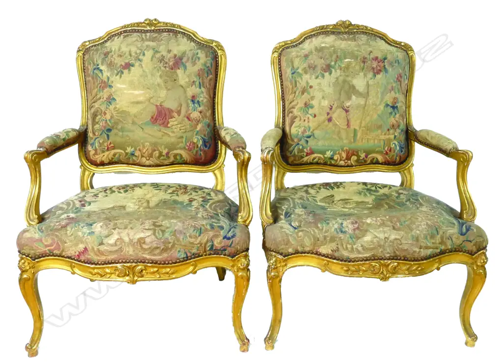 A pair of old French giltwood framed fauteuils upholstered in good tapestries Image 1++