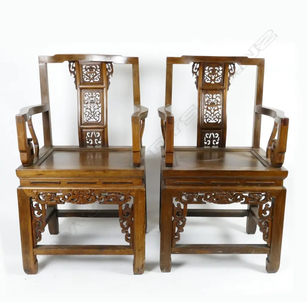 A pair of Chinese teak Emperor and Empress open elbow chairs Image 1++