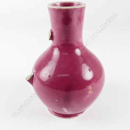 P. Hutson & Co. red glazed bottle vase