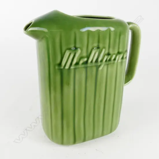 A vintage Crown Lynn green glazed McAlpine refrigerator jug