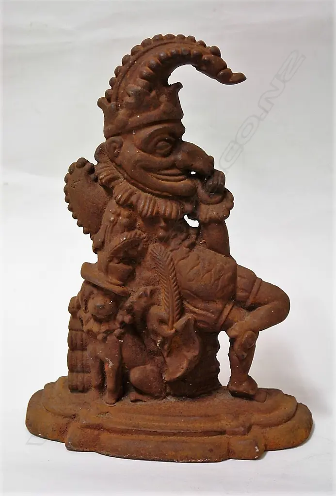 A cast iron 'Punch' door stop Image 1++