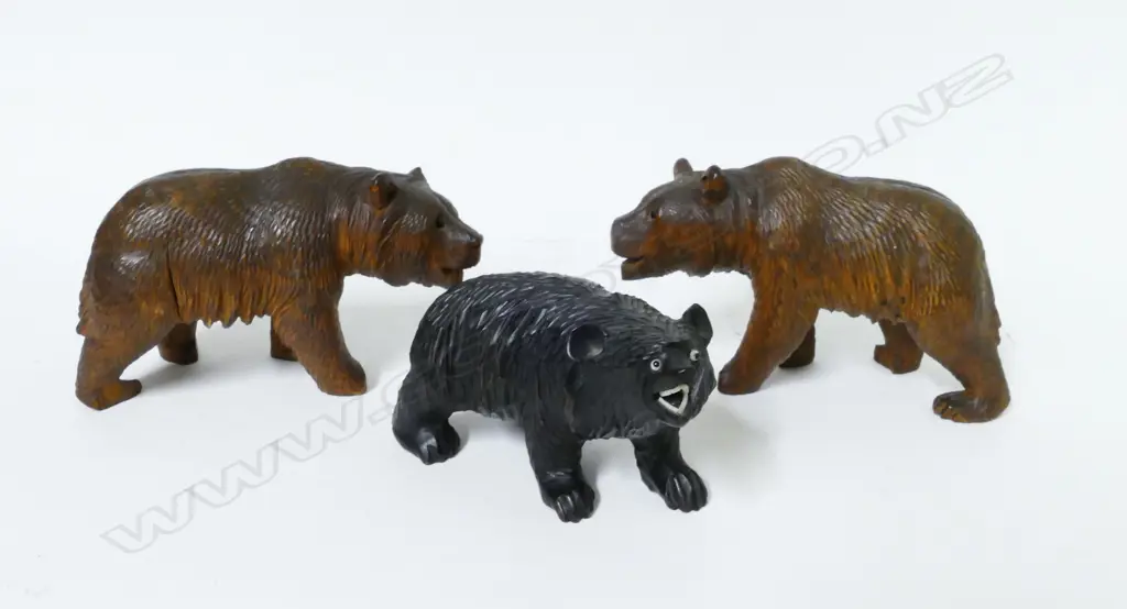 Three miniature carved wood standing bears Image 1++