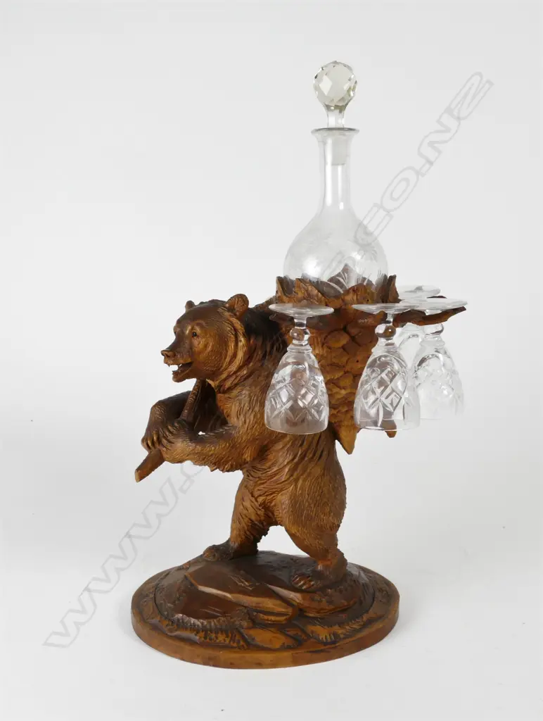 A Black Forest carved decanter stand Image 1++