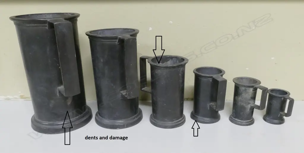 A graduated set of six Continental pewter measures Image 1++