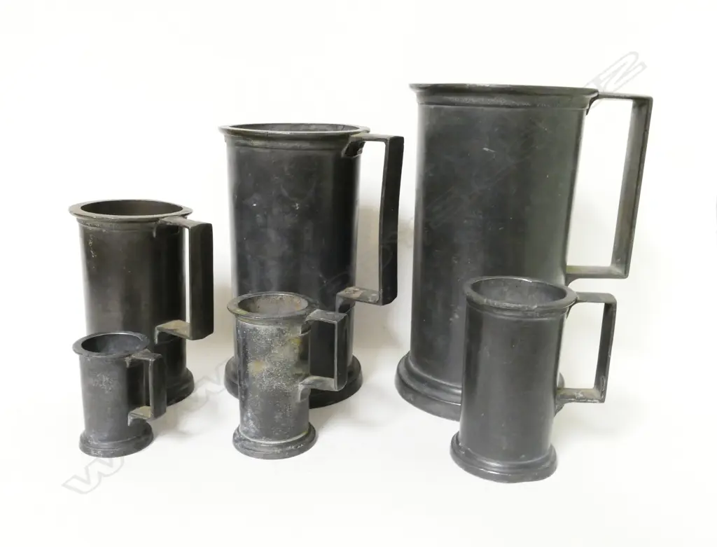 A graduated set of six Continental pewter measures Image 1++