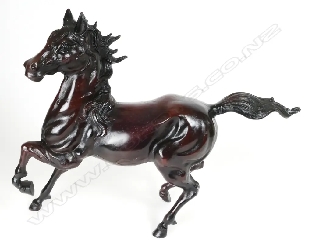 A cast steel statuette of a galloping horse Image 1++