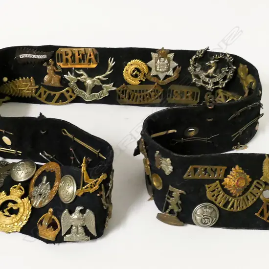 An Air Force great coat belt mounted with badges and buttons