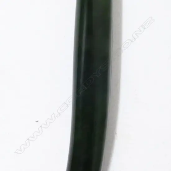 A greenstone ear pendant