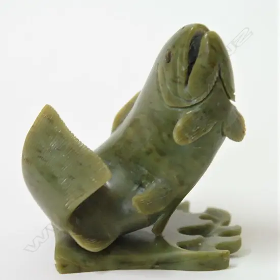 A well carved N.Z Kokopu greenstone model of a leaping 'Kokopu (speckled trout)