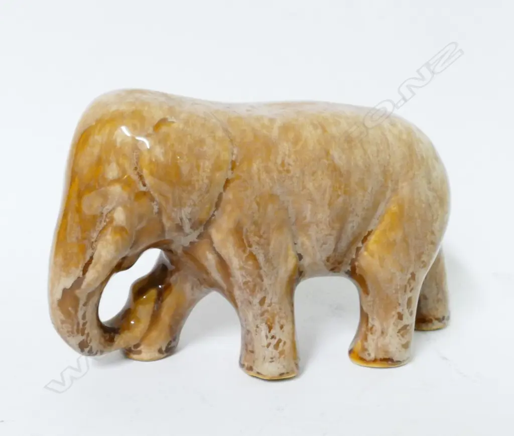 A Crown Lynn (Ambrico) light brown trickle glaze standing elephant Image 1++