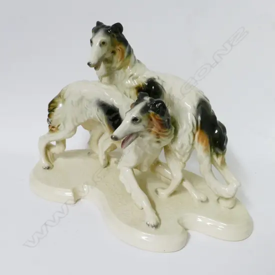 A German porcelain sculpture of two borzoi hounds