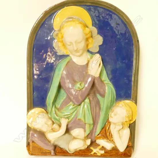 An earthenware plaque in the manner of Della Robbia