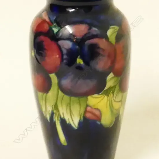 A small William Moorcroft 'Pansy' pattern vase