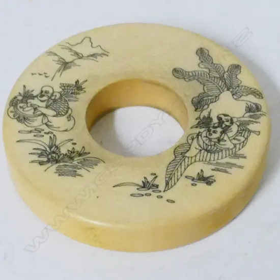 A Chinese ivory bi-disc